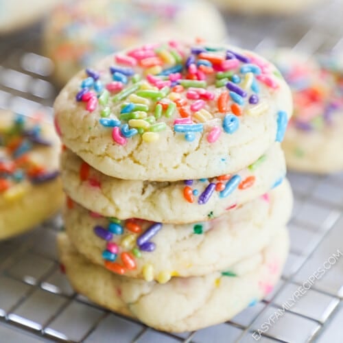 four birthday cake cookies with cake mix stacked.