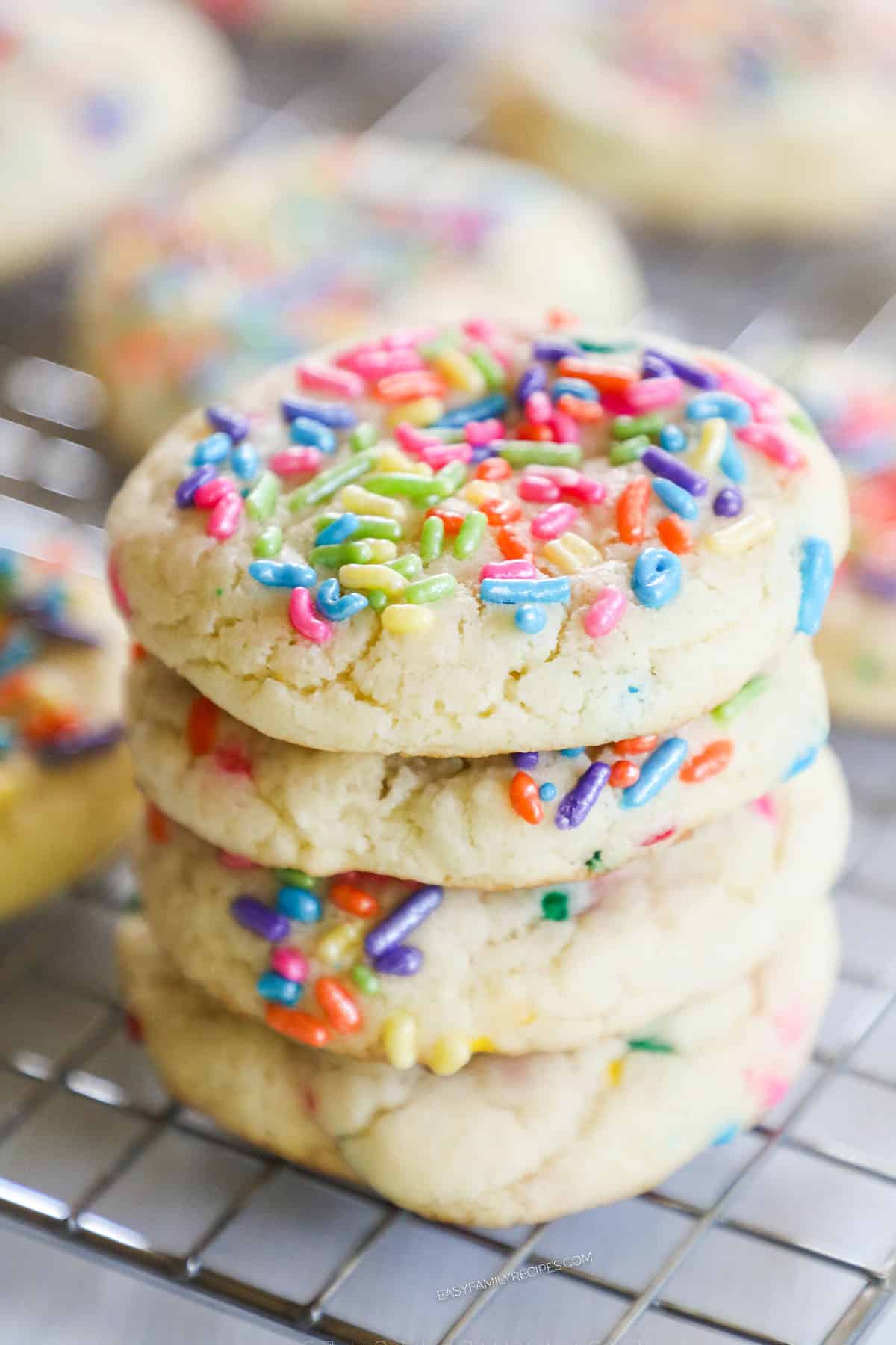 four birthday cake cookies with cake mix stacked. 