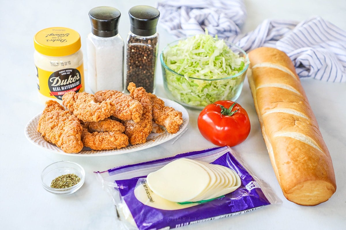 Ingredients needed to make chicken tender subs. chicken tenders, mayo, lettuce, tomatoes, cheese, bread, salt, pepper and oregano 