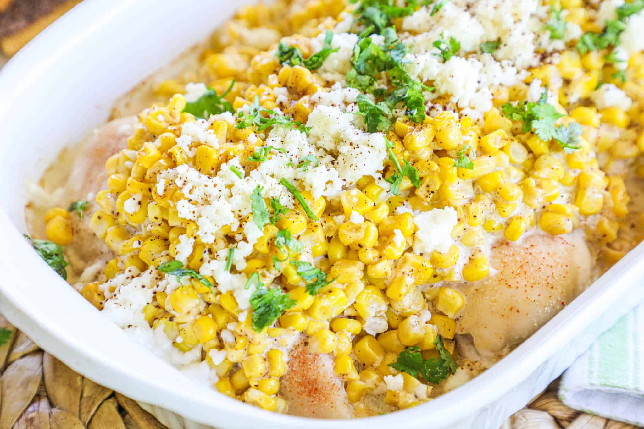 Mexican Street Corn Recipe prepared in a casserole dish and ready to serve for an easy dinner.