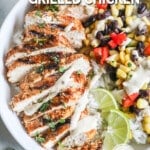 Sliced southwest grilled chicken with lime, sauce, and veggies. The text reads, "southwest grilled chicken."
