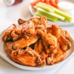 A plate full of Asian Zing Wings, ready to eat.