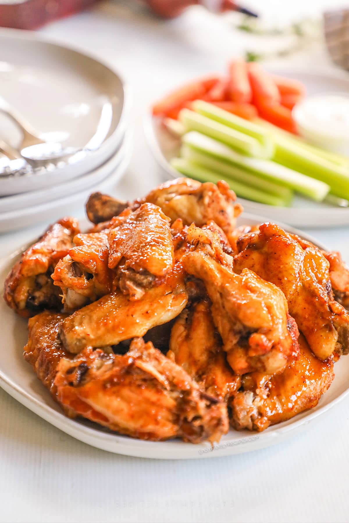 A plate full of Asian Zing Wings, ready to eat.