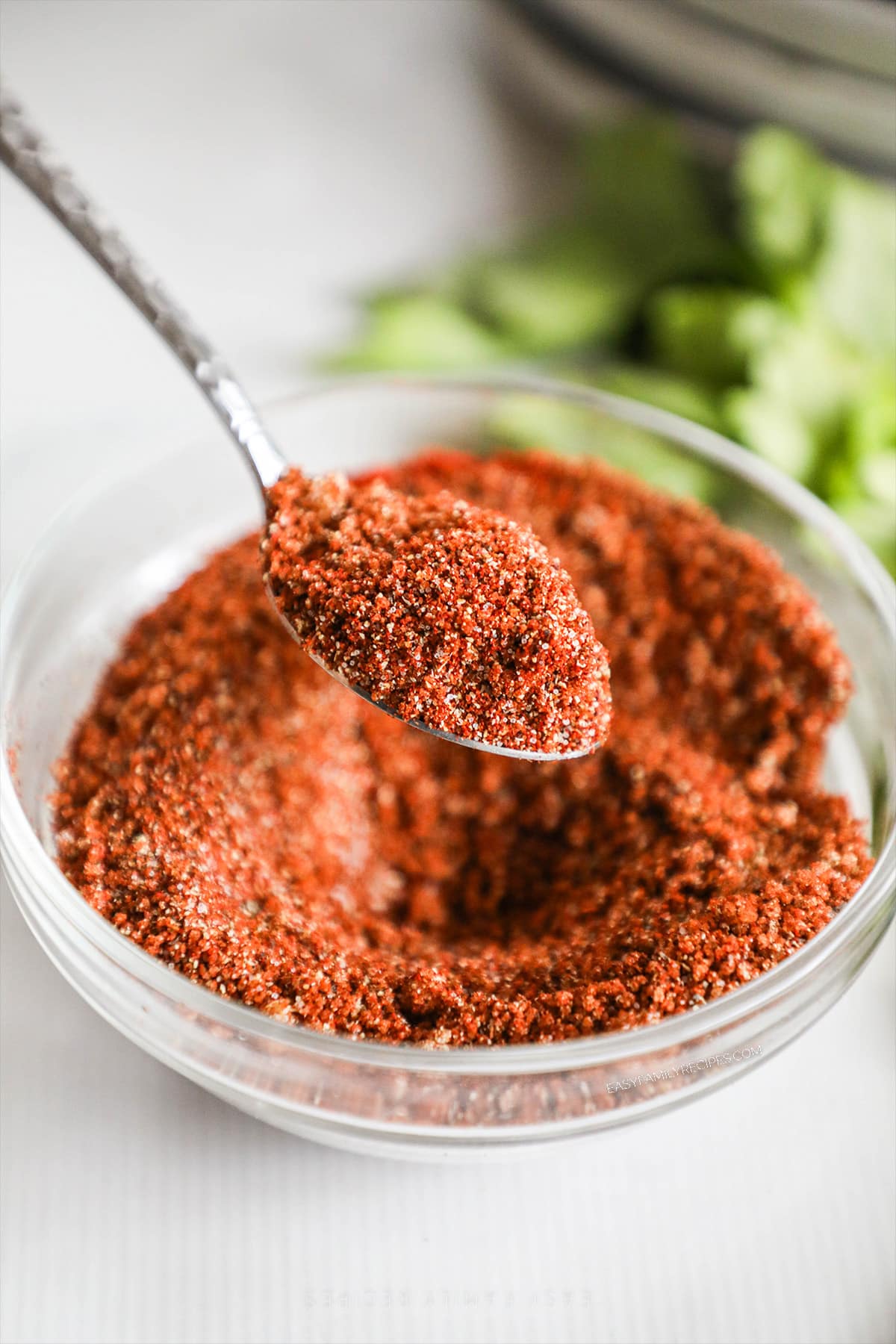 Homemade BBQ Chicken Rub getting scooped up with a spoon.