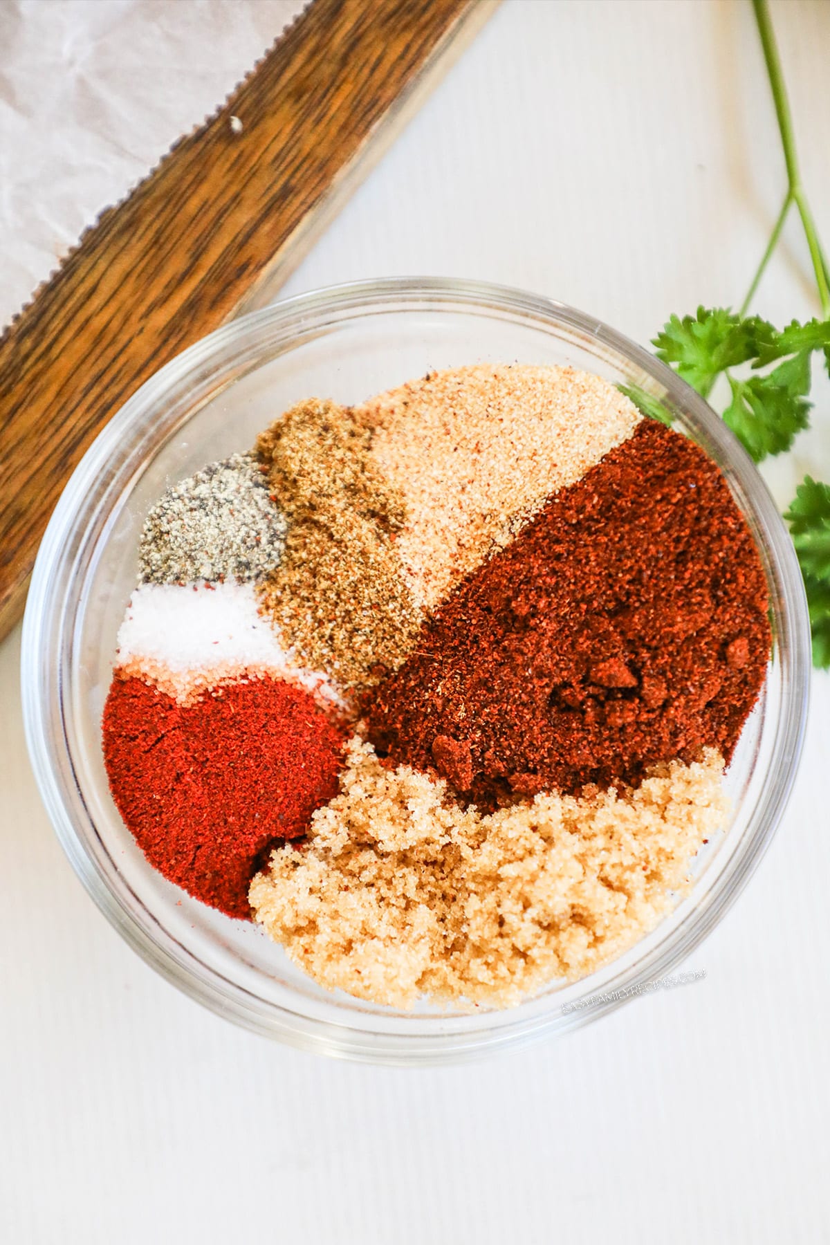 Spices for BBQ Chicken rub in glass dish.