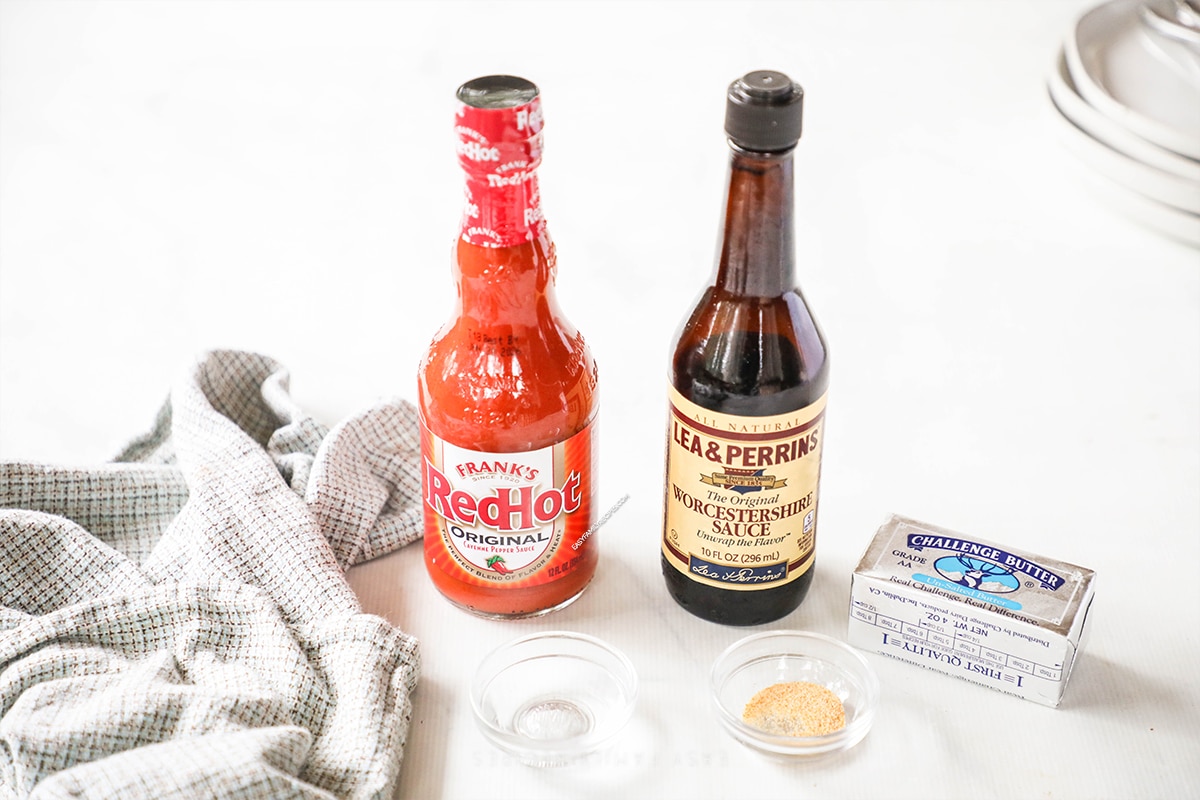 Ingredients for homemade buffalo sauce including hot sauce, Worcestershire sauce, butter, garlic, and cornstarch.