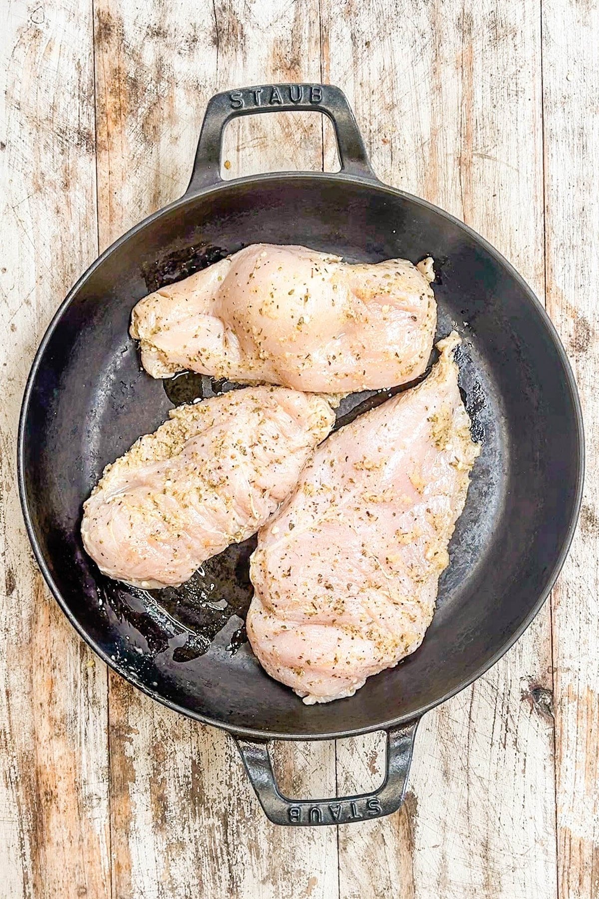 A top view of marinated Baja Chicken cooking in a skillet for Baja Chicken Tacos. This is step 3 of the process.