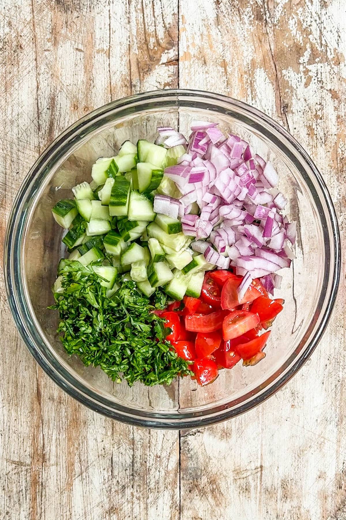 Fresh cut veggies in a bowl for stuffing inside pita.