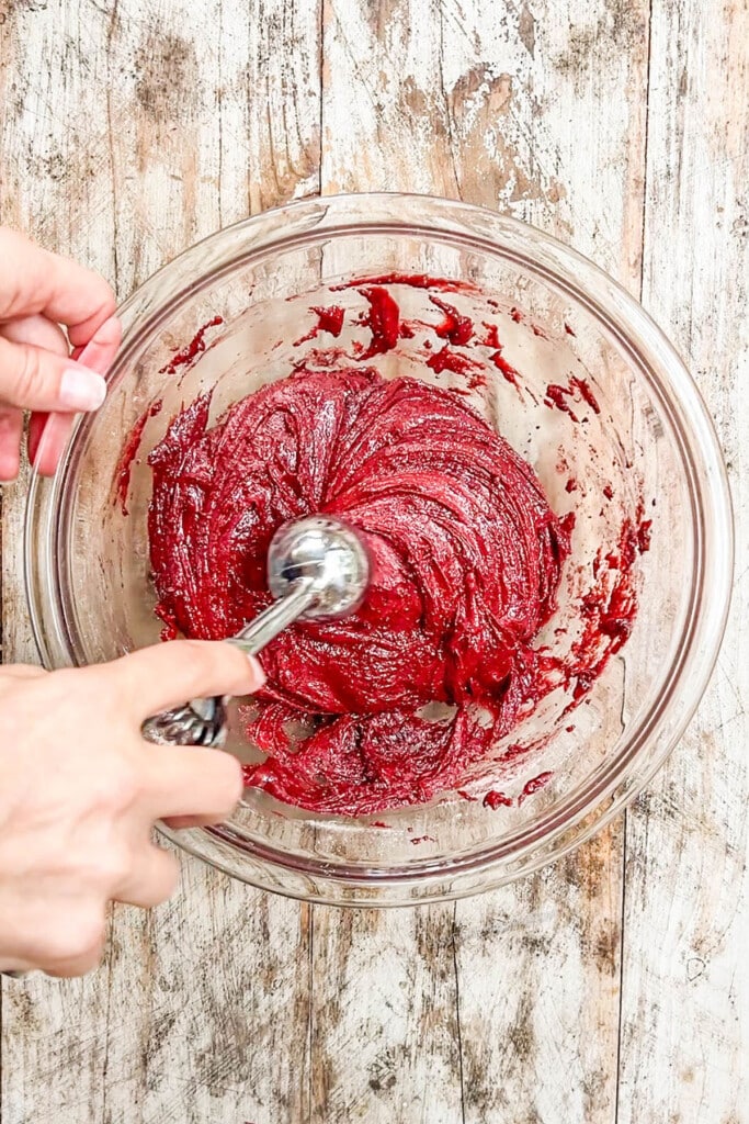 red velvet cookie dough in a mixing bowl.