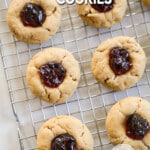 A top view of Peanut Butter & Jelly Cookies lined up on a wire rack. The text reads, "Peanut Butter Jelly Cookies."