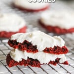 two halves of red velvet cookies with cake mix stacked on a cooling rack.