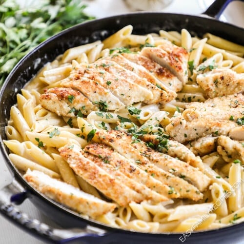 Garlic Parmesan Chicken Pasta in a black skillet, ready to serve.