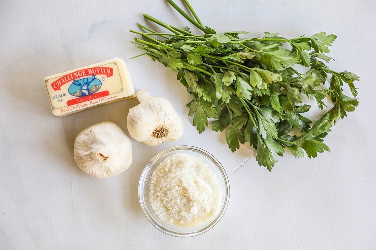 above image of garlic parm wing sauce ingredients on the counter. 