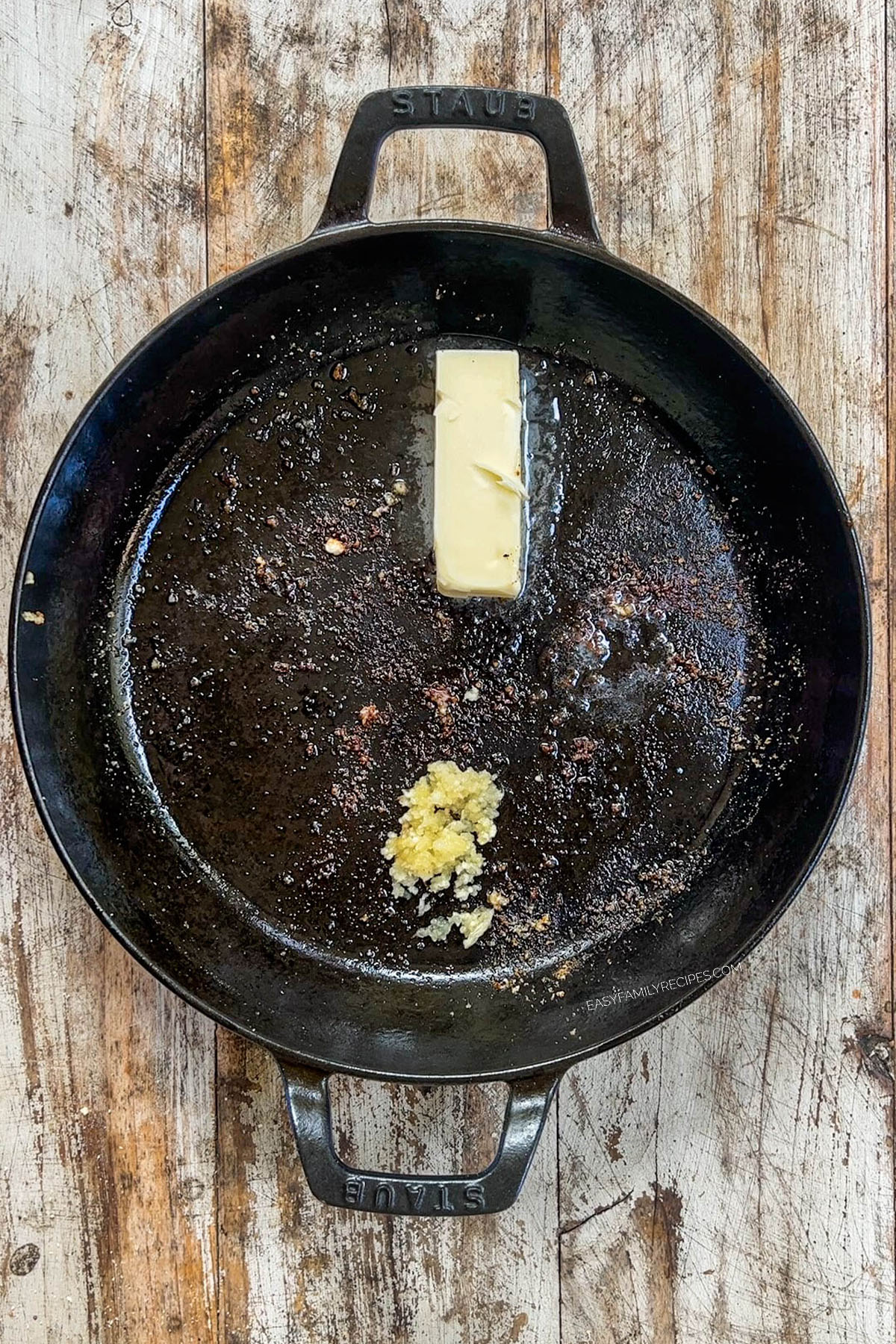 Butter and garlic in a skillet, the base of the creamy sauce in Garlic Parmesan Chicken Pasta.