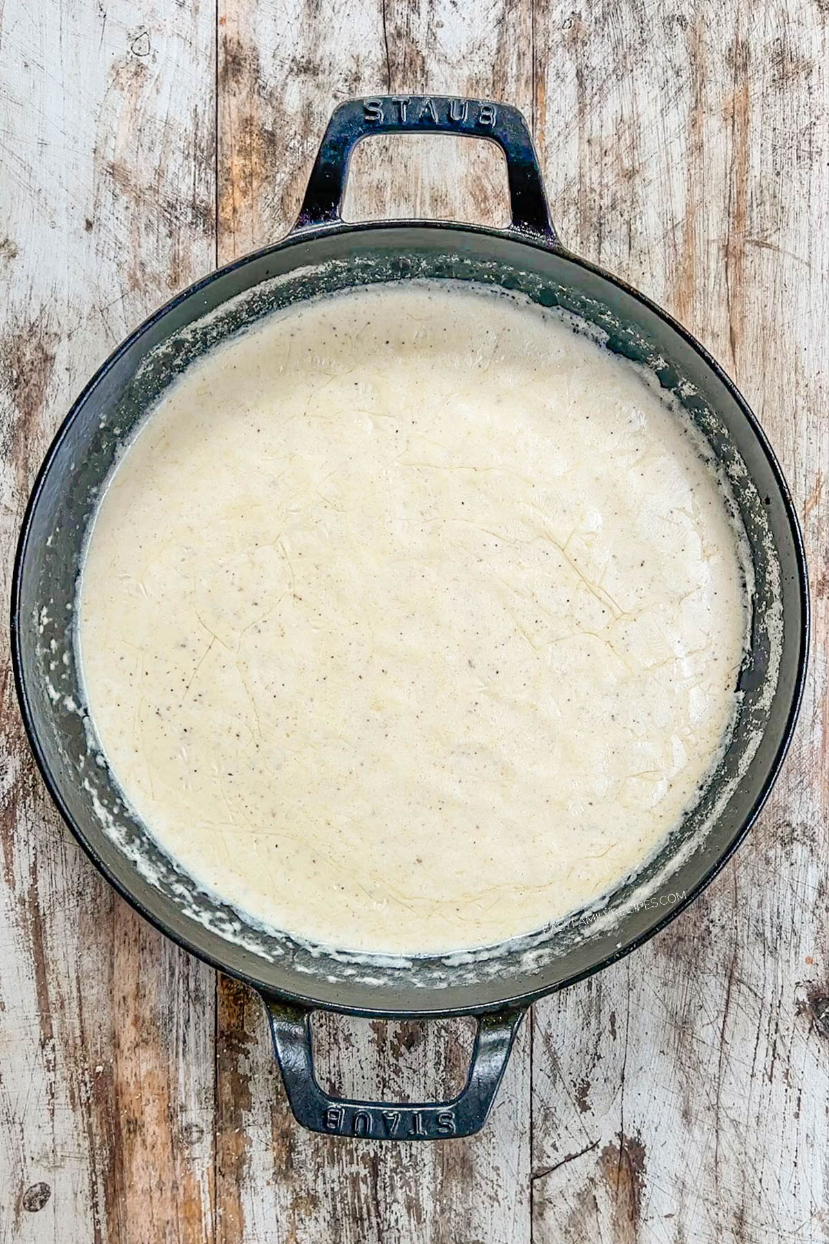 A top view of Garlic Parmesan Chicken Pasta in process. The creamy sauce has been made.