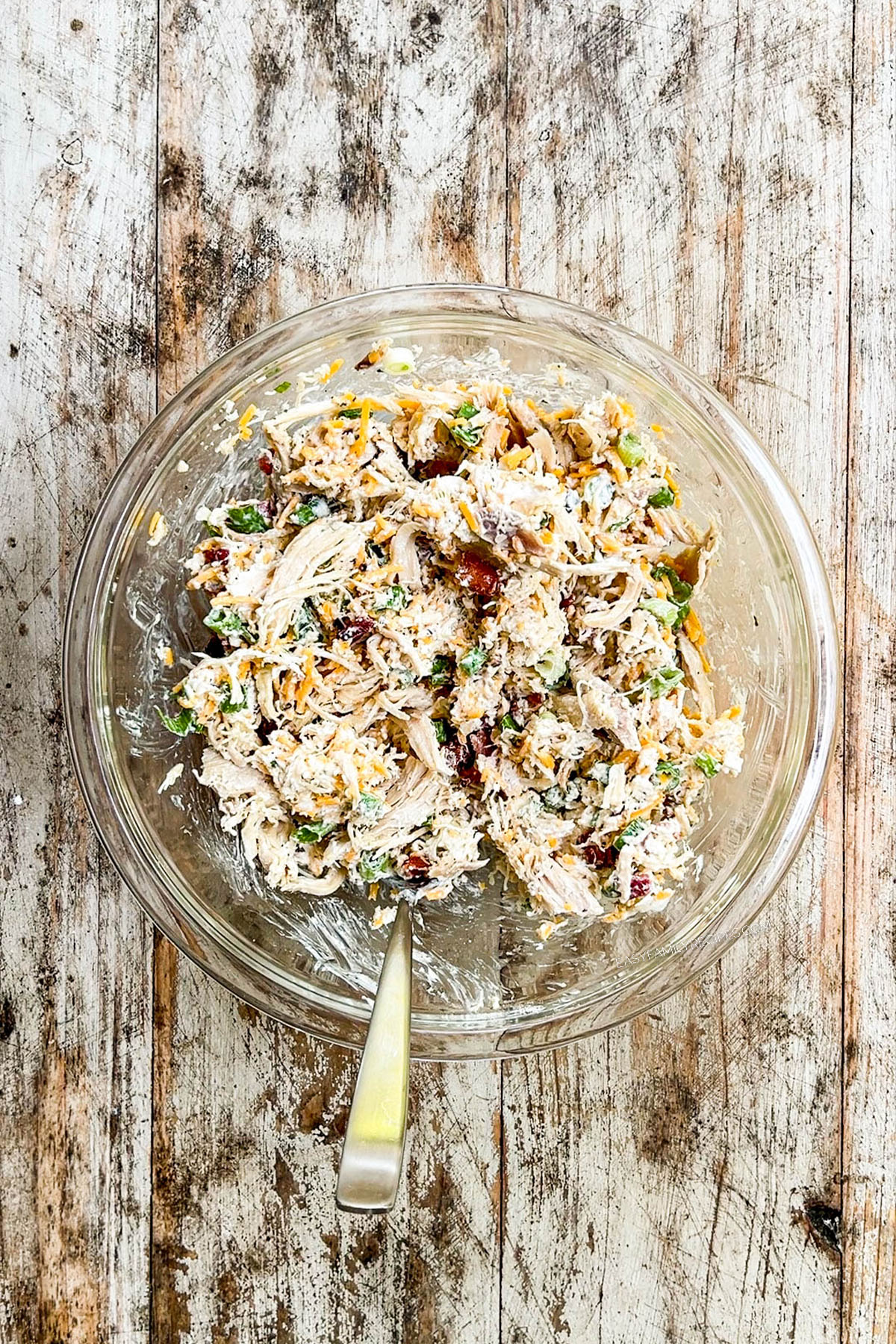 Mixed-up filling ingredients for Chicken Bacon Ranch Quesadillas in a glass bowl.