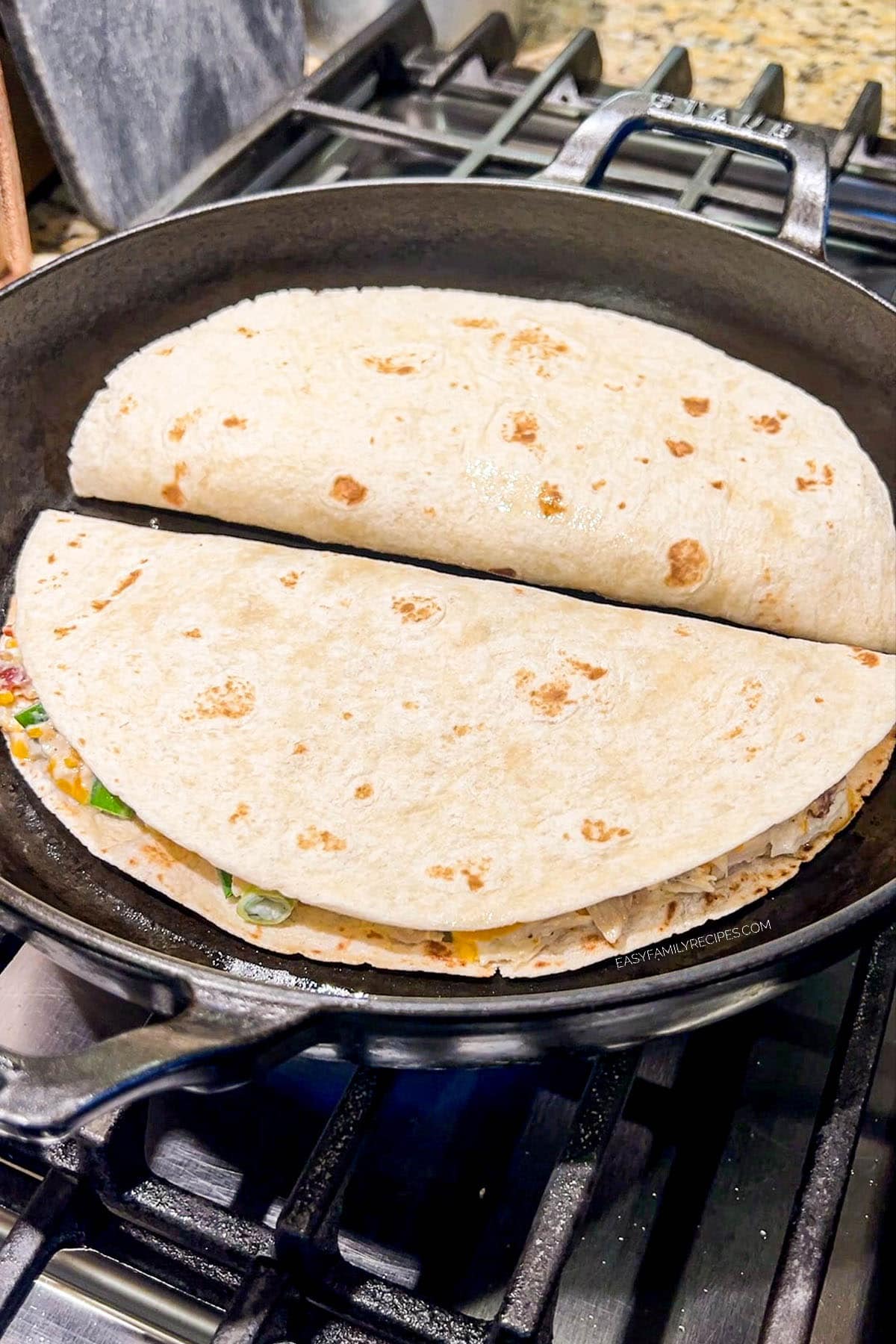 Chicken Bacon Ranch Quesadilla being cooked in a skillet.