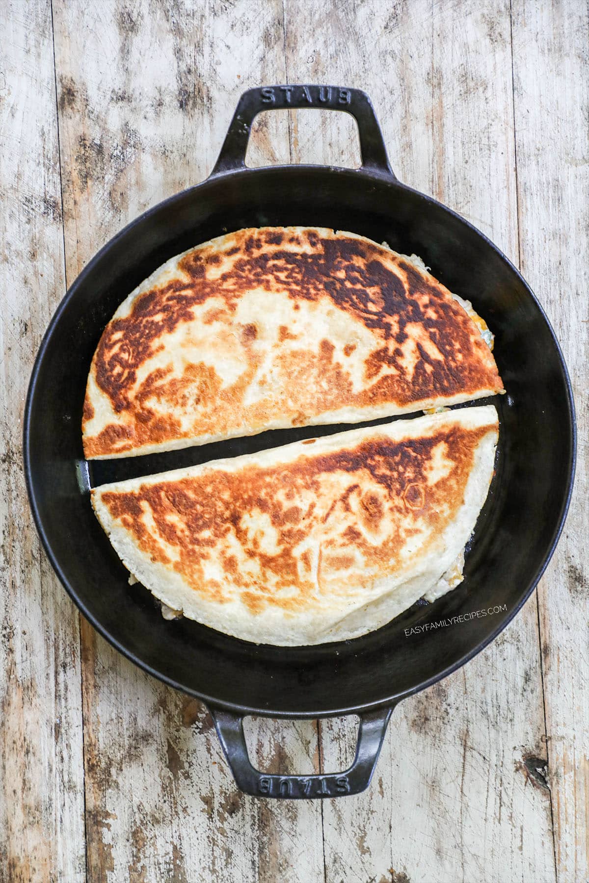 Golden brown Chicken Bacon Ranch Quesadilla being cooked in a skillet.