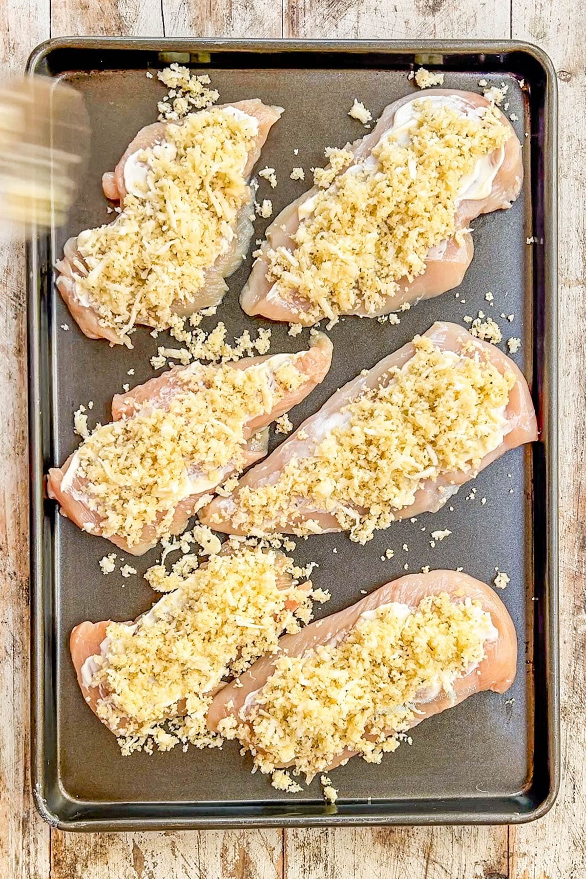 A top view of Monterey Jack Unfried Chicken being prepared.