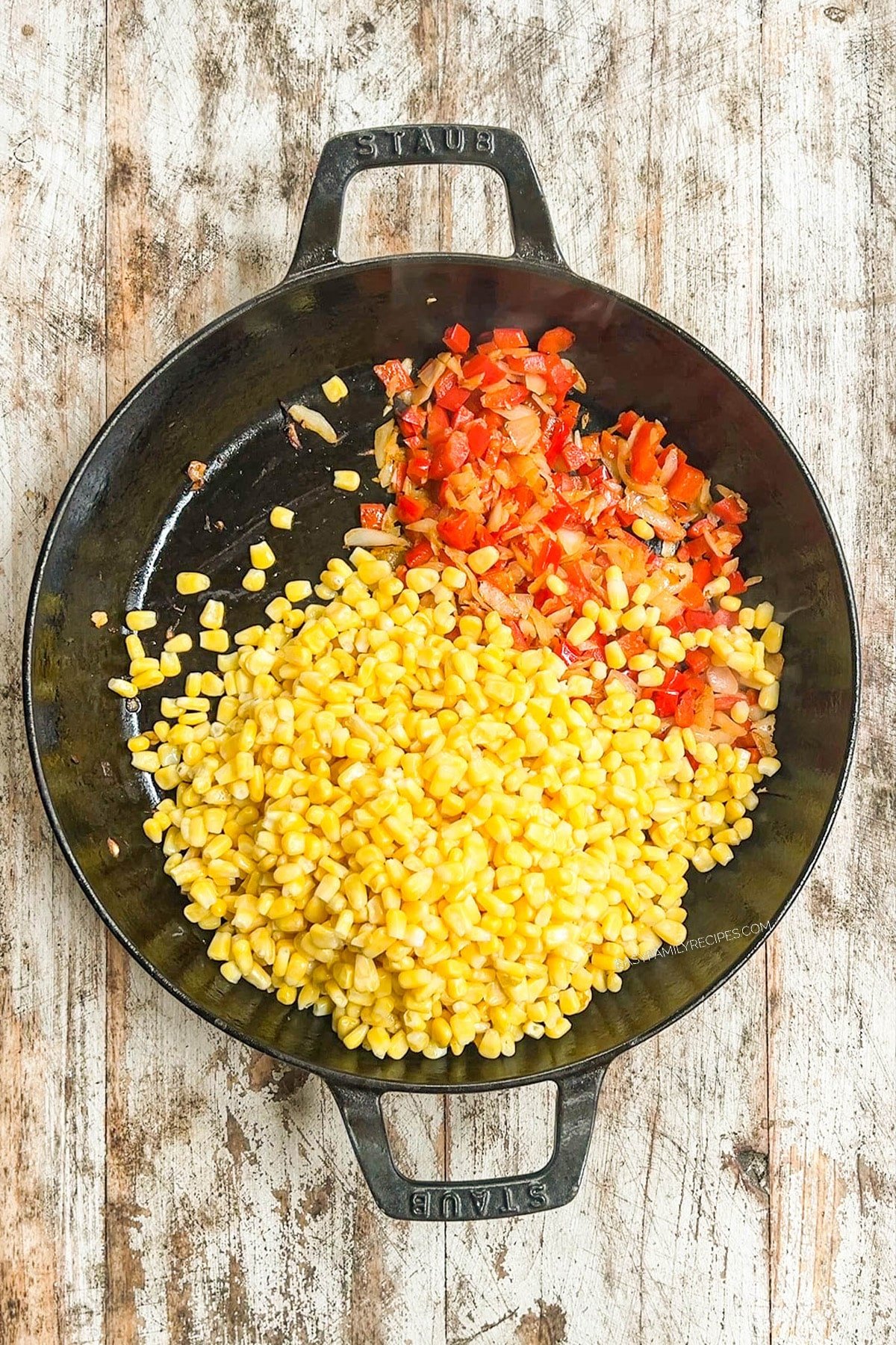 Corn is added to the skillet for Southwest Corn.