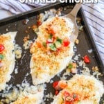 A sheet pan with Monterey Jack Unfried Chicken, ready to serve. A blue and white striped towel is in the background. The text reads, "Monterey Jack Unfried Chicken"