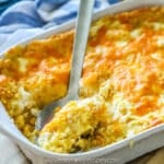 Spoonful of light fluffy corn pudding.
