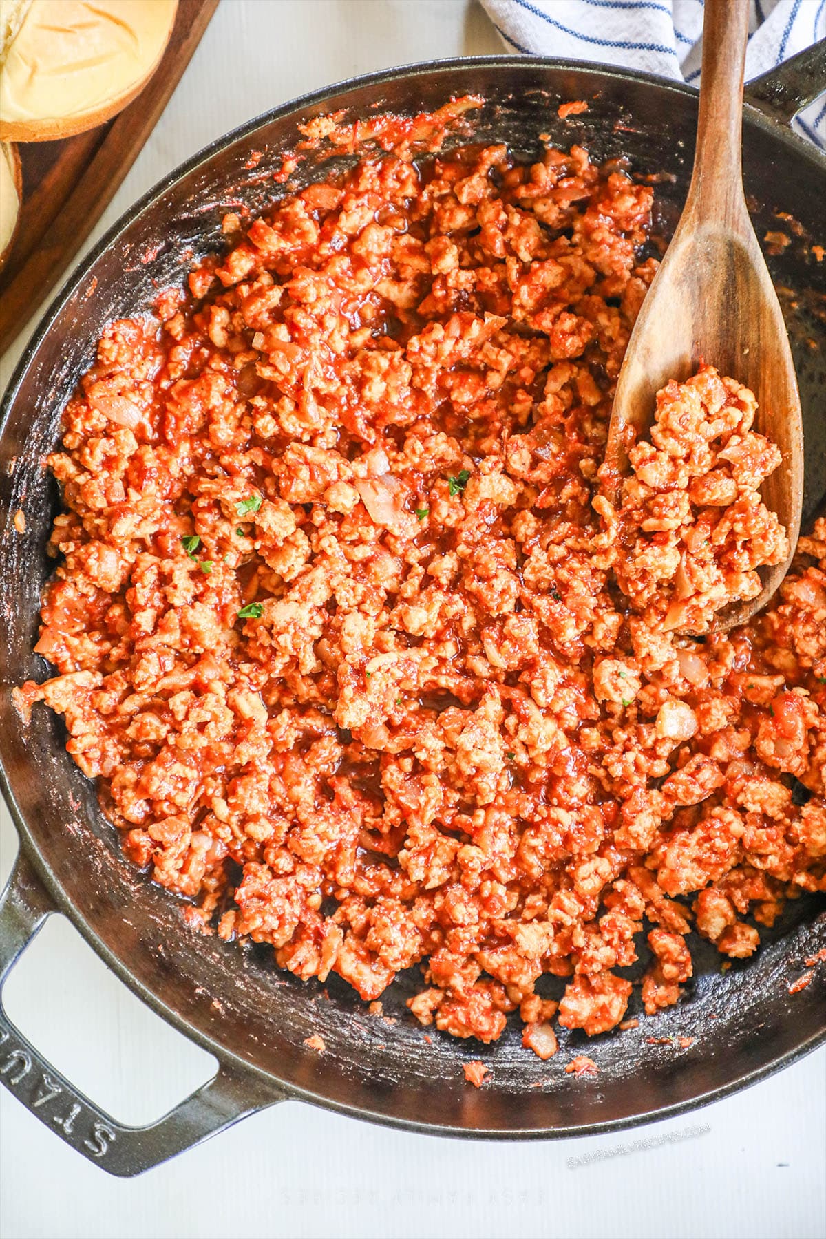 above image of a skillet filled with ground chicken sloppy joe sandwich filling.