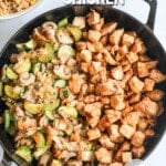 A top view of a black skillet full of Hibachi Chicken and Vegetables on a white background. The text reads, "Hibachi Chicken."