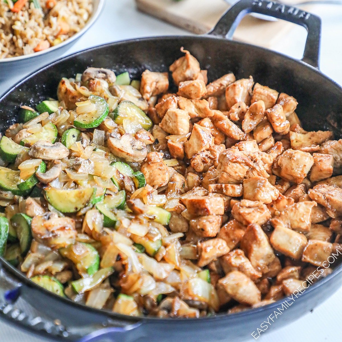 A black skillet full of Hibachi Chicken and Vegetables.