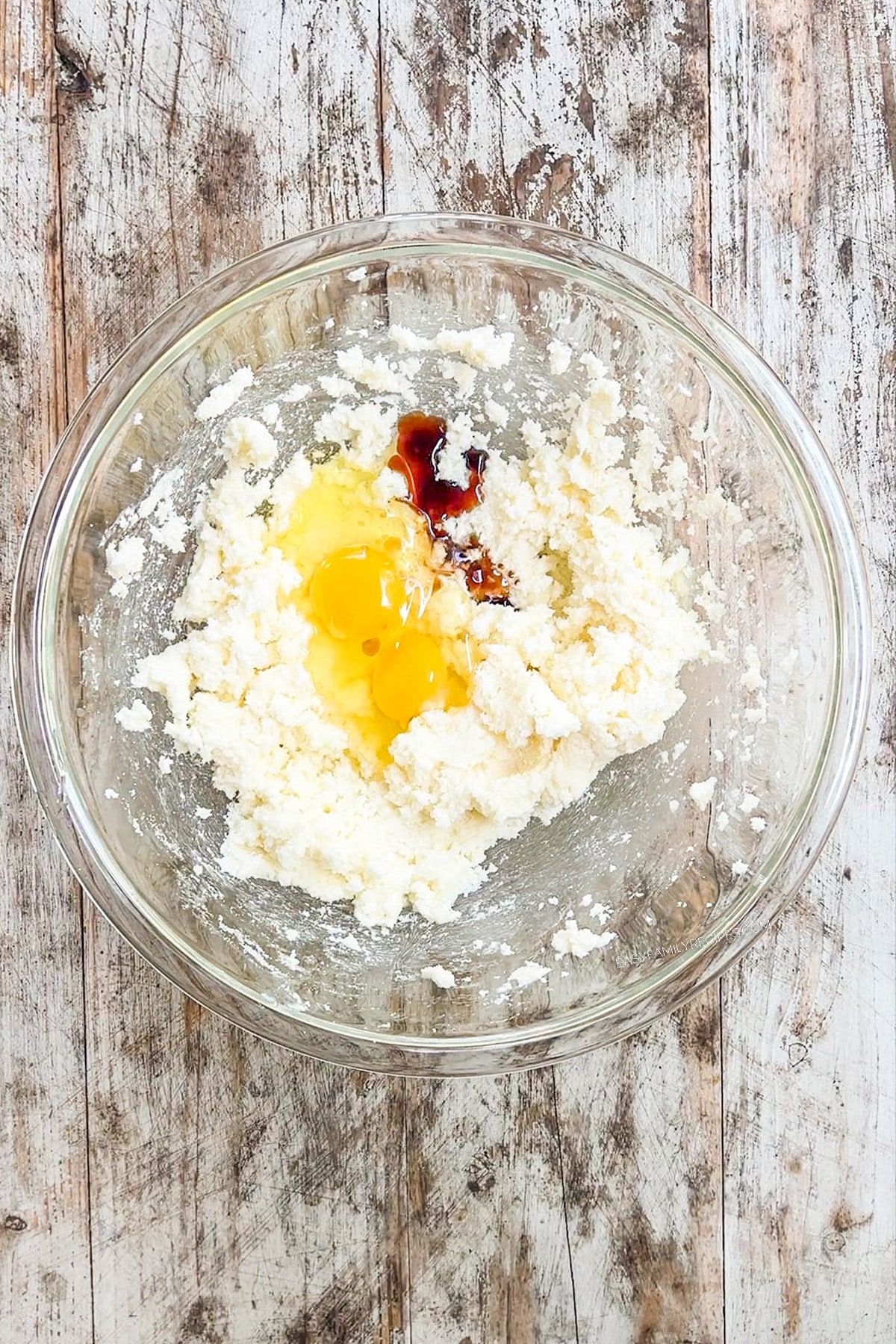 Step 2 for making chocolate marshmallow cookies: The butter and sugar are fluffed together and the egg and vanilla are added to the dough for chocolate marshmallow cookies.