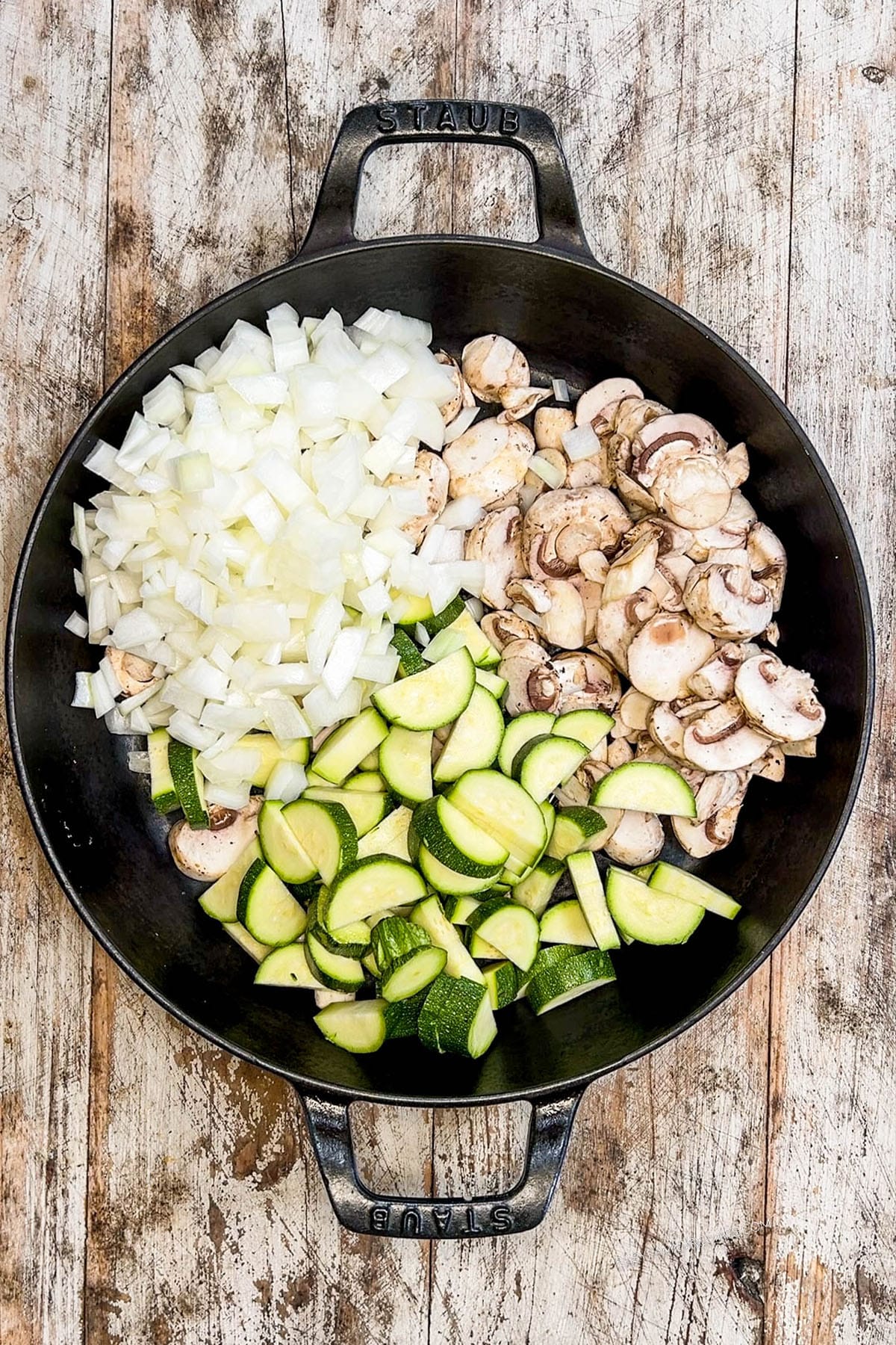 Step 1 of making Hibachi Chicken: The veggies are added to the skillet and cooked.