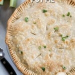 A top view of a chicken pot pie with parsley on it plus carrots and celery in the background. The text reads, “Easy Chicken Pot Pie.”