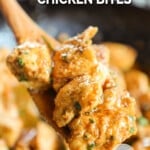 A close-up of a wooden spoon with garlic butter chicken bites in it. The text reads, “Garlic Parmesan Chicken Bites.”