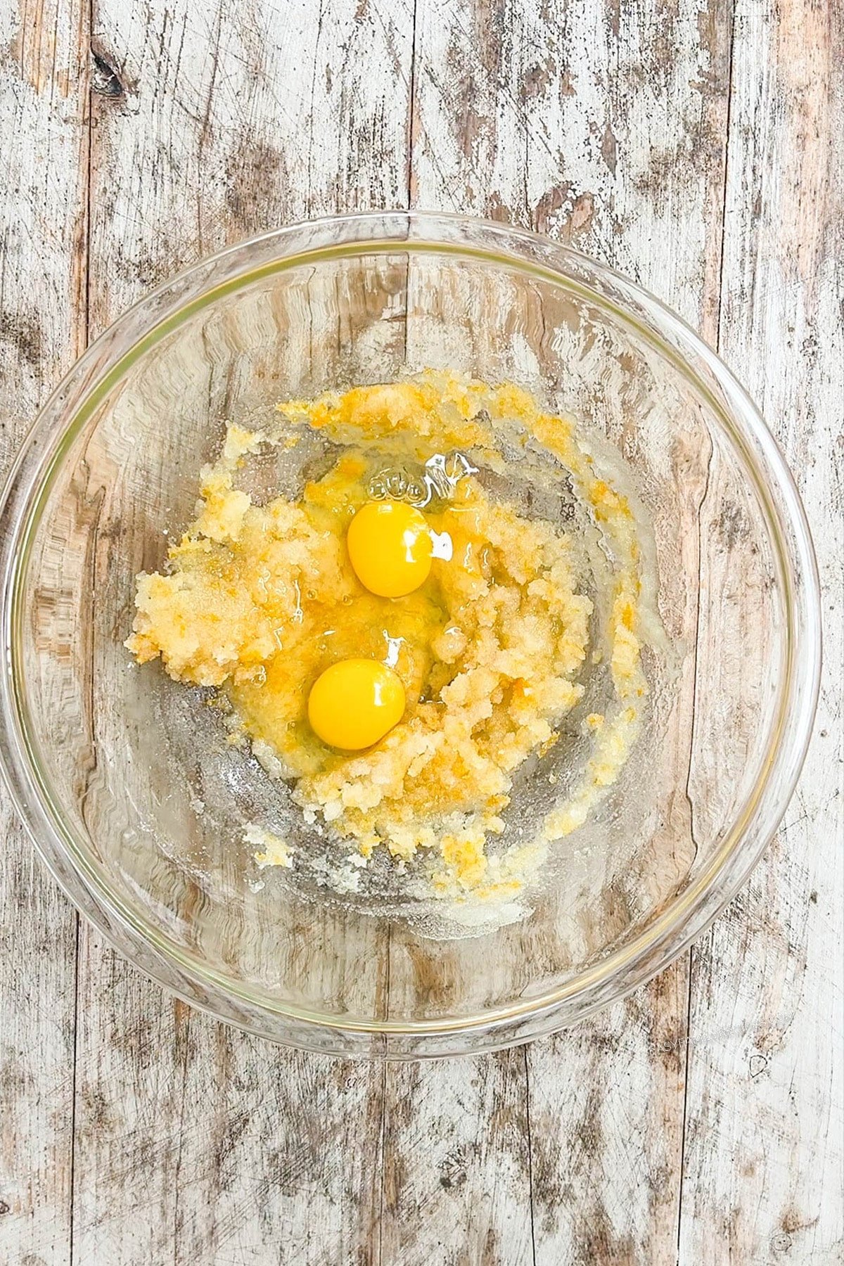 egg, sugar, oil, and vanilla in a mixing bowl.