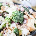 Bowl of broccoli cauliflower salad ready to serve for potluck.