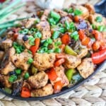 Cajun Chicken in skillet garnished with green onions