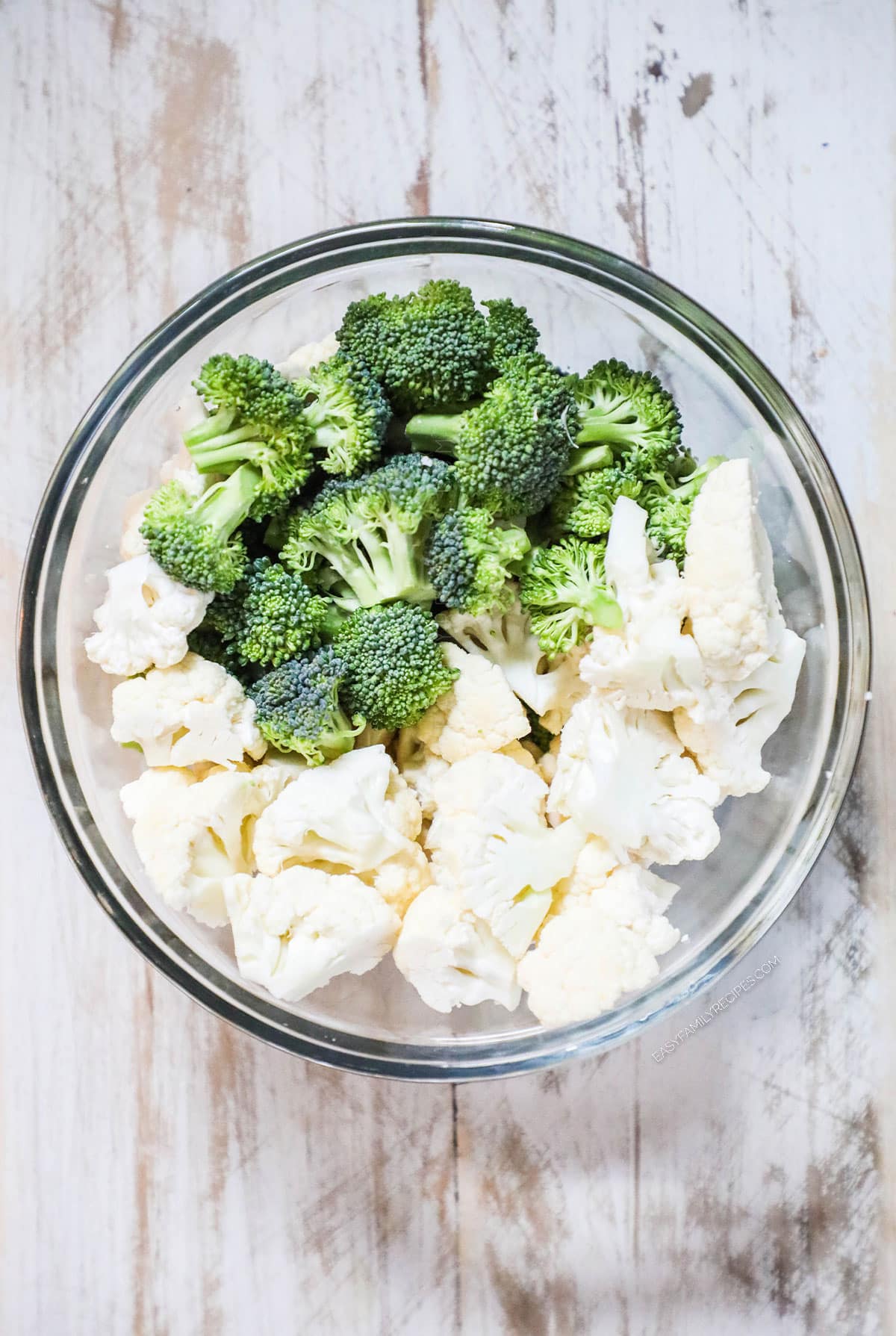 How to make Broccoli Cauliflower Salad step 1: Chop broccoli and cauliflower into small florets.
