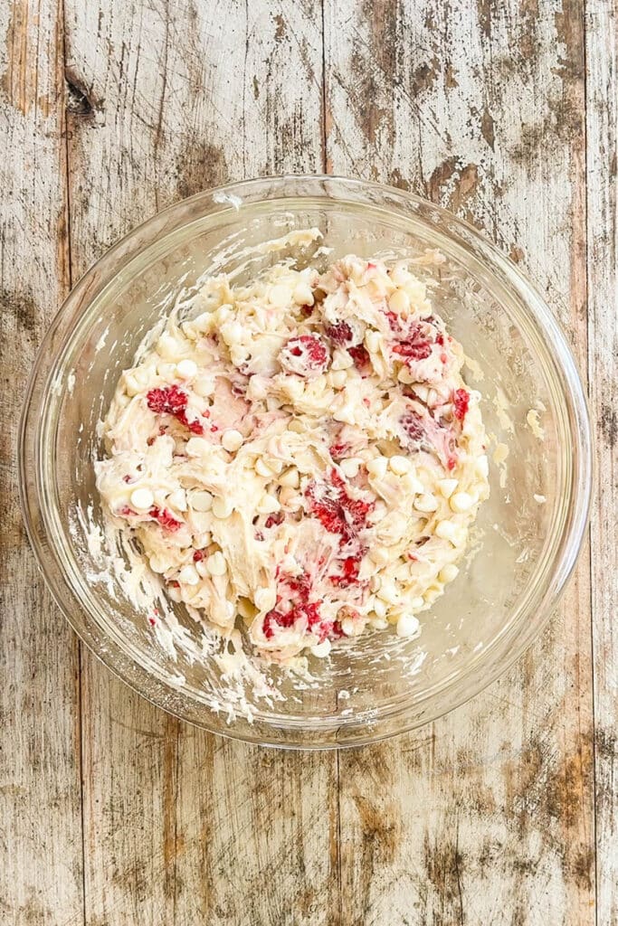 raspberry cheesecake cookie dough in a mixing bowl.