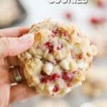 a raspberry cheesecake cookie held.