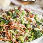 A white bowl filled with Broccoli Crunch Salad. The text reads, "Broccoli Crunch Salad."