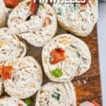 Chicken bacon ranch pinwheels on a board. The text reads, "Chicken Bacon Ranch Pinwheels"