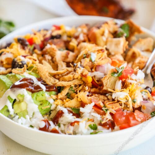 BBQ chicken bowls in a white bowl with a silver fork.