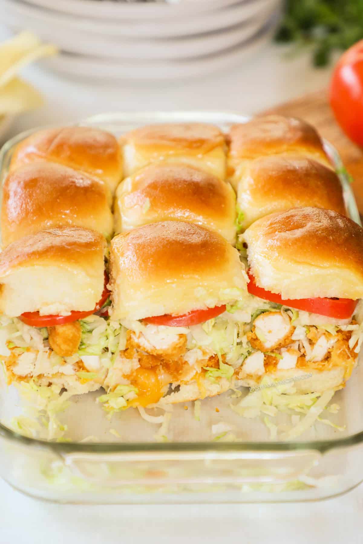 Chicken tender sliders in a baking dish. 