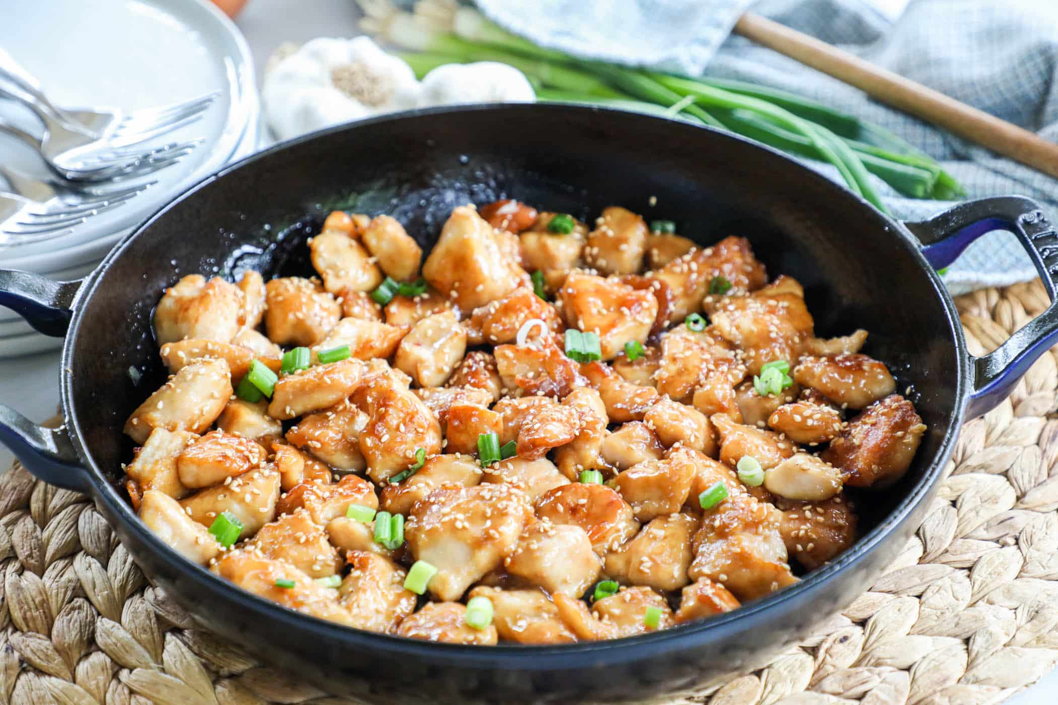 Honey Sesame Chicken bites in a pan and ready to serve for easy dinner.