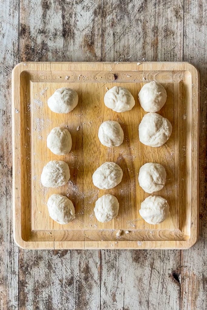 dough balls on a cutting board.