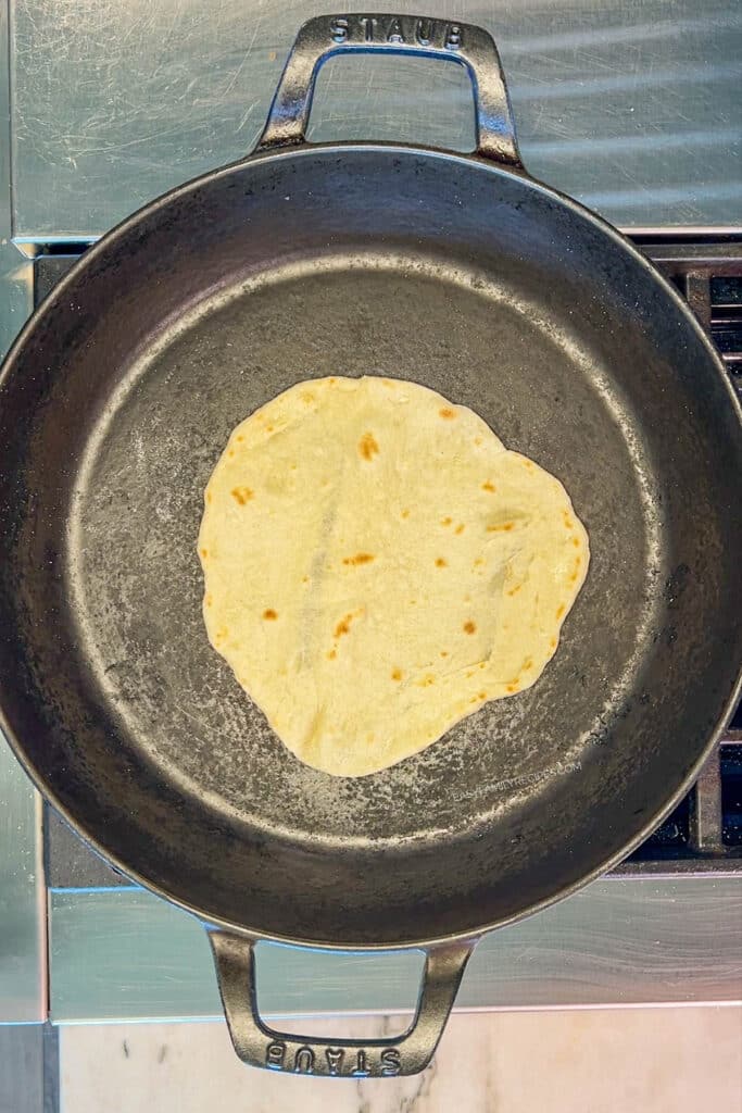 cooked tortilla in a skillet. 