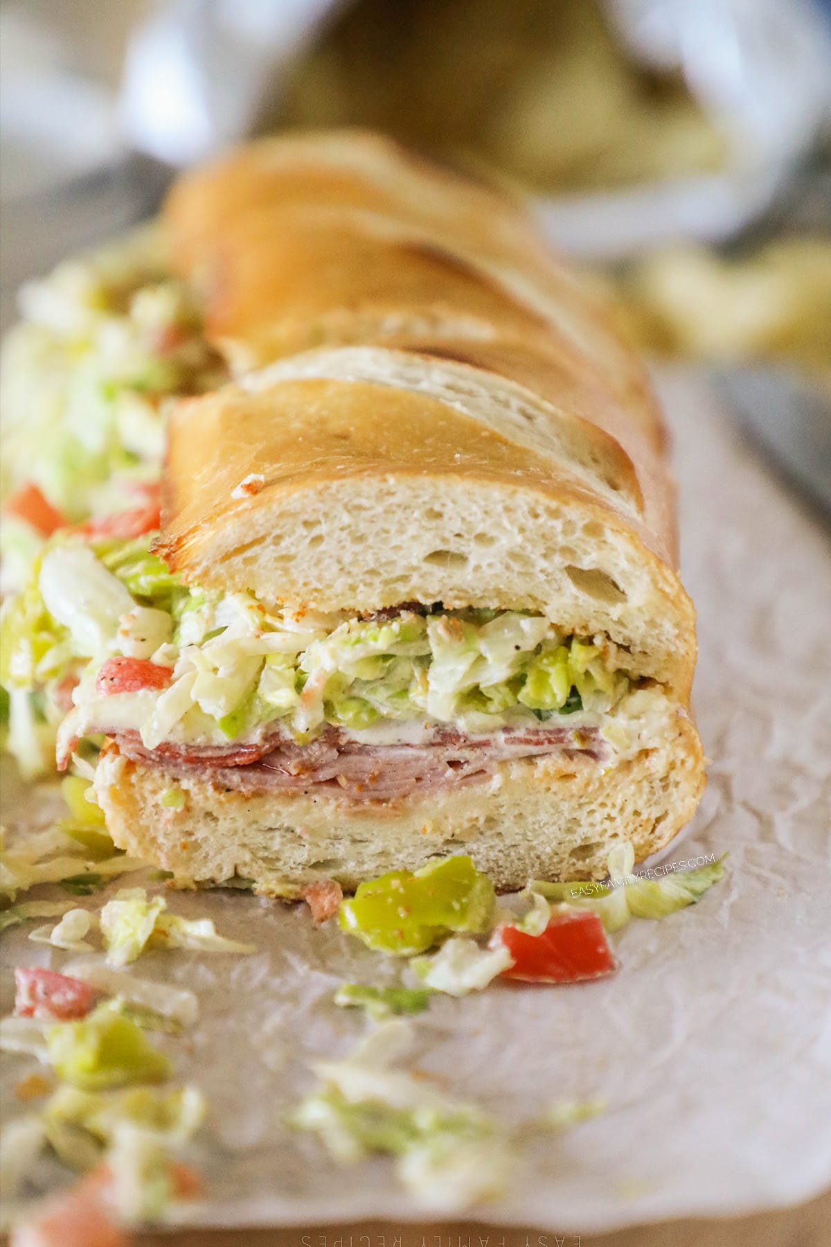 Italian Grinder Sandwich on parchment paper.