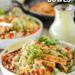 Side view of Chicken Fajita Bowls with dressing in the background. The food is in white dishes on a distressed wood background. The text reads, "Chicken Fajita Bowls"