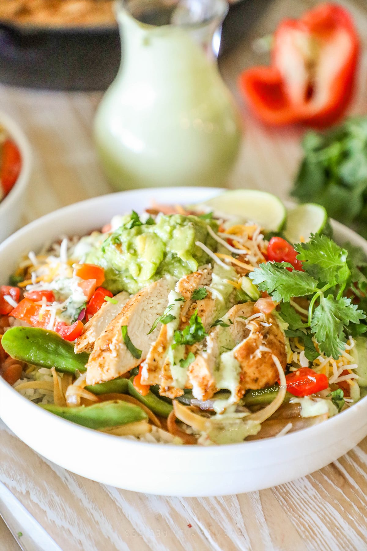 Side view Chicken Fajita Bowls in a white bowl