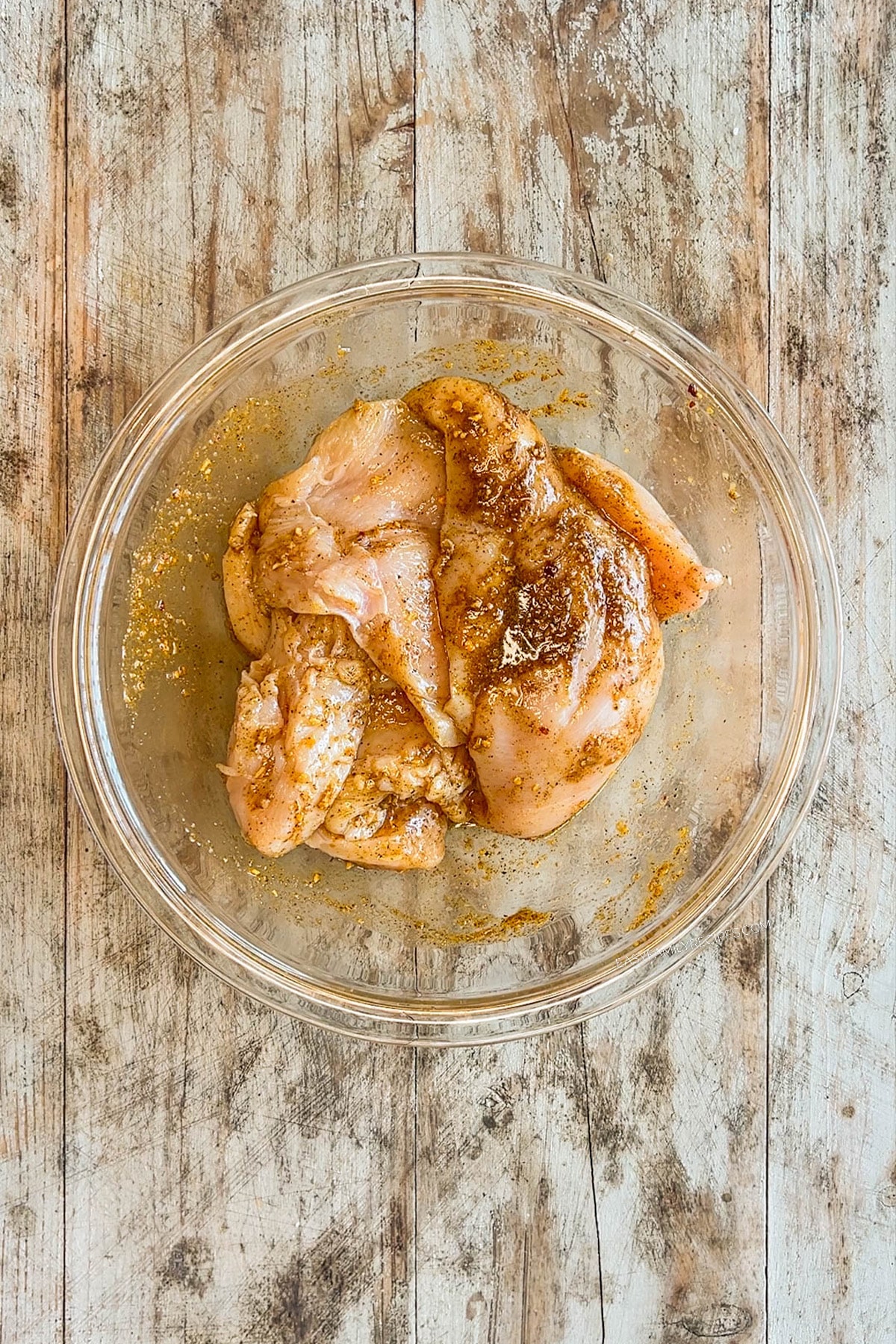 Marinating the chicken for chicken fajita bowls